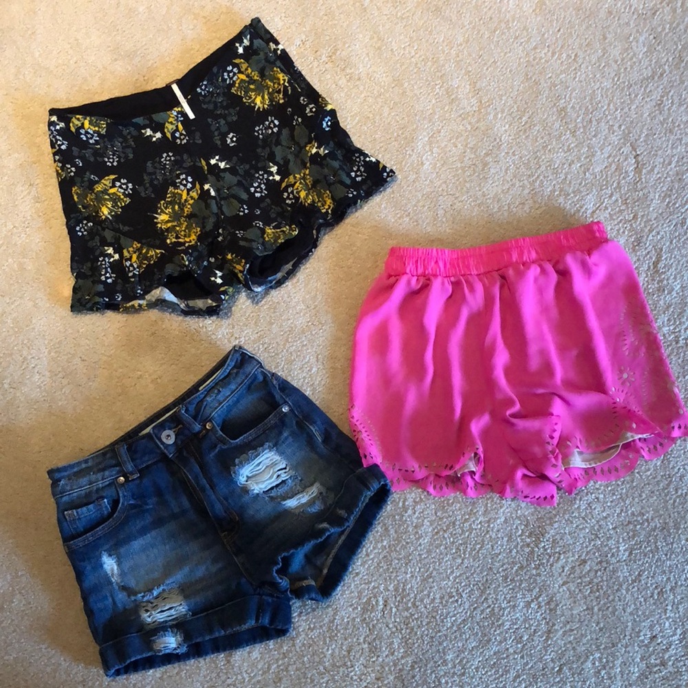 Two colorful flowy shorts and one denim shorts